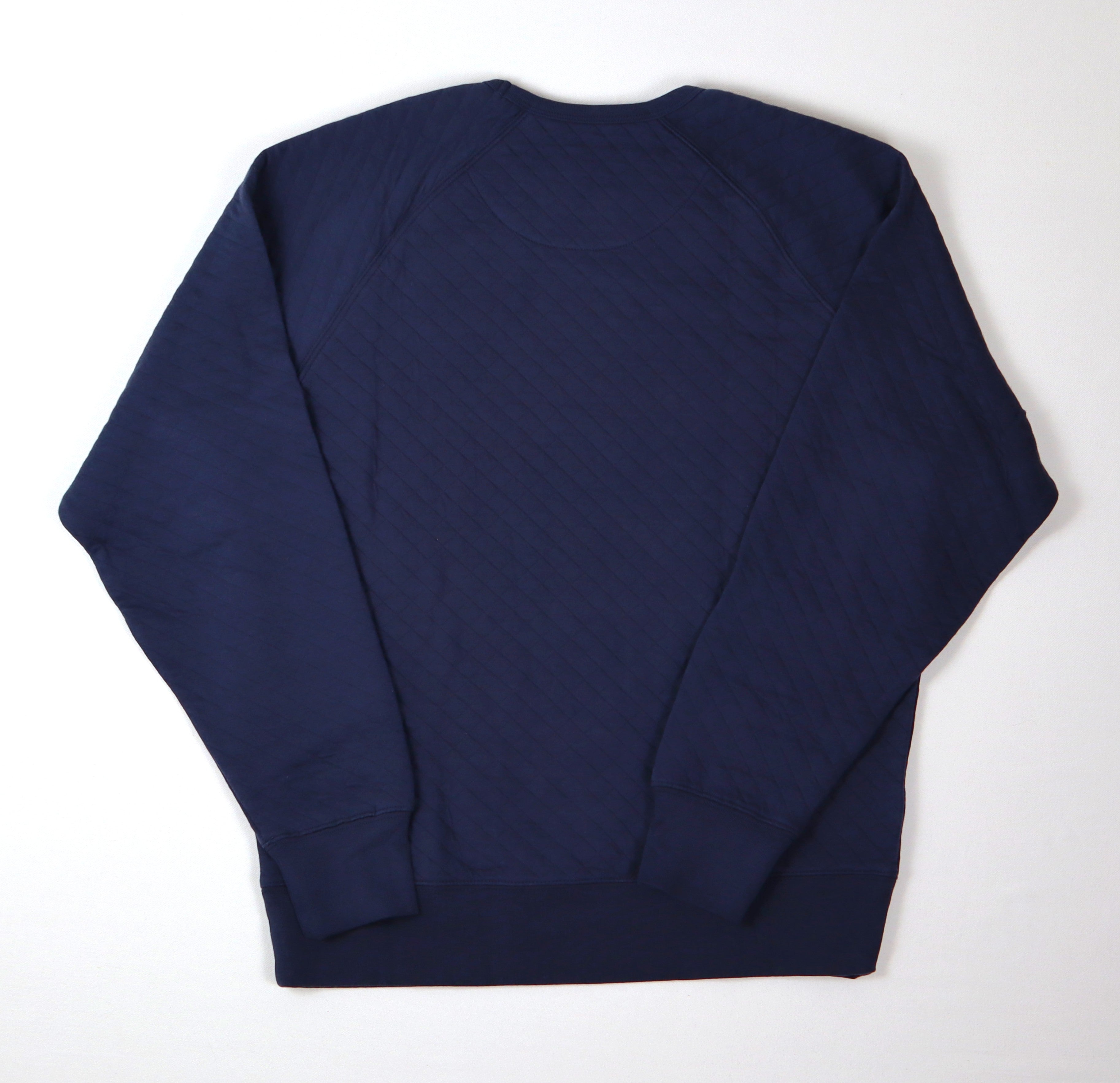 Achterkant van donkerblauwe Trek sweater